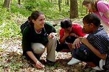 Teacher and students, outdoors